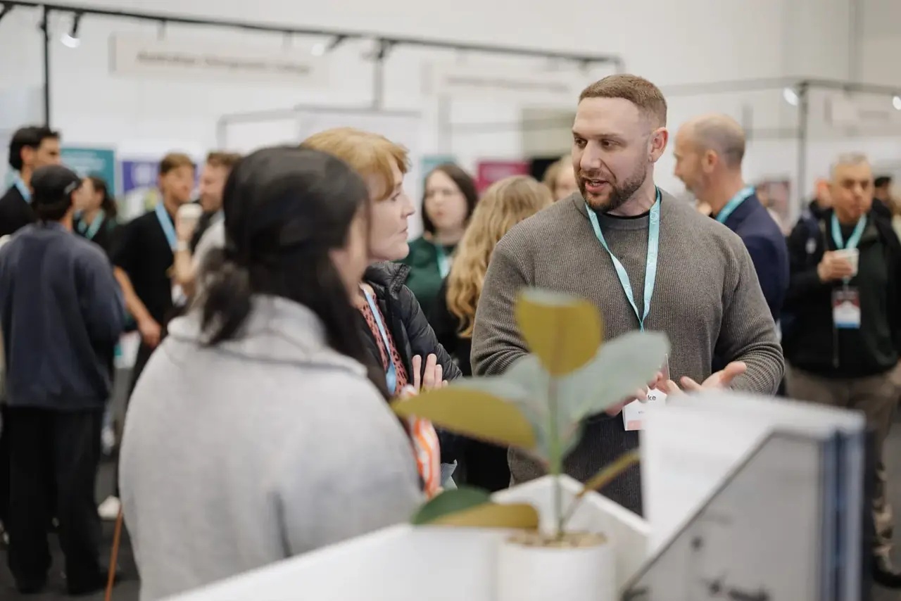 Talking with practitioners at the stand